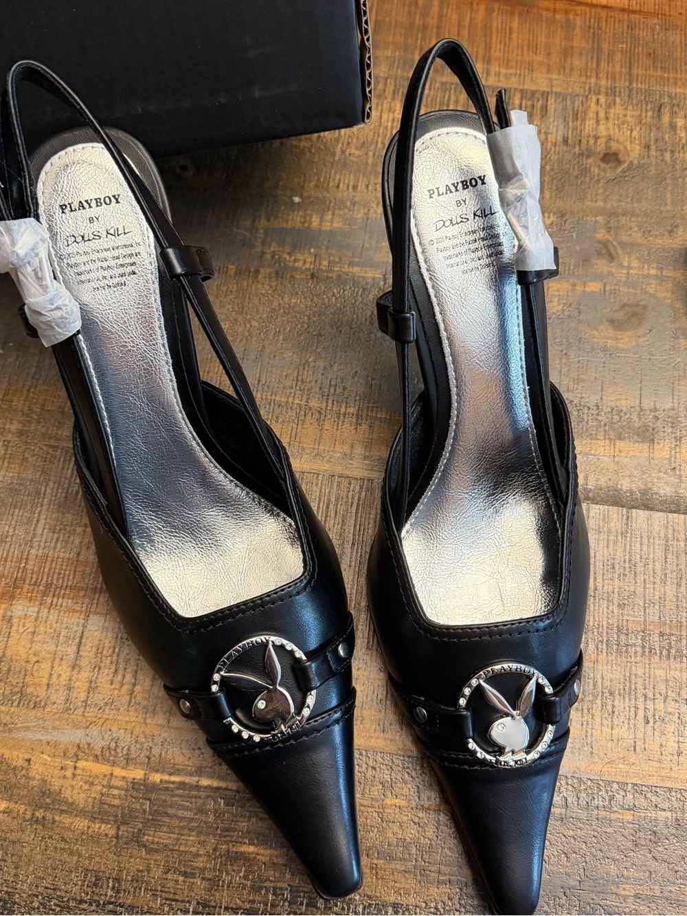 Dolls Kill Black Pointed Slingback Heels with Silver Playboy Emblem
